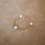 White and gold cross bracelet