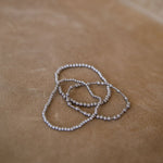 Stack of 3 silver bracelets