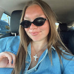 Brunette model styling necklace with denim