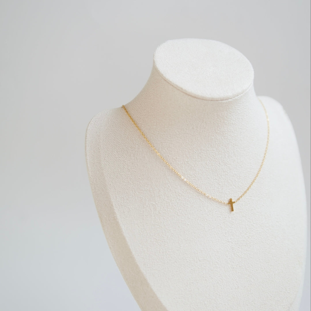 Cross necklace on mannequin