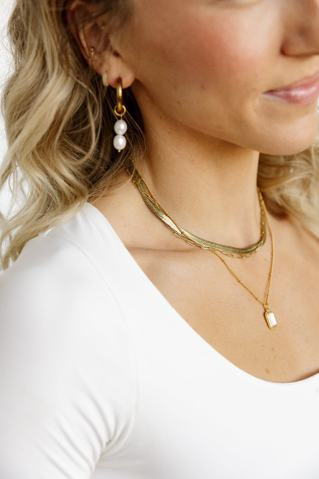 Model layering necklaces
