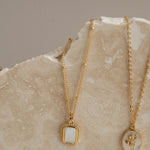 Gold necklace on rock