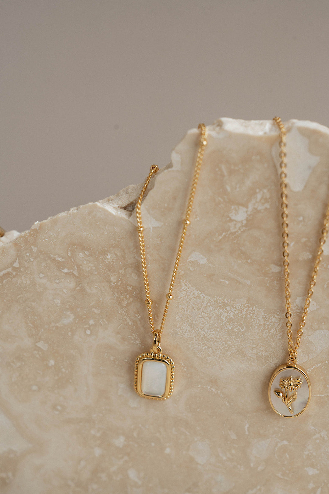 Gold necklace on rock
