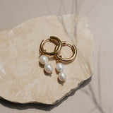 Gold pearl hoops on rock