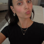 Brunette model with hoops and necklaces