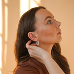 Model displaying pearl hoops