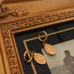 Close up of gold huggies on frame