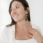 Brunette model gold necklace