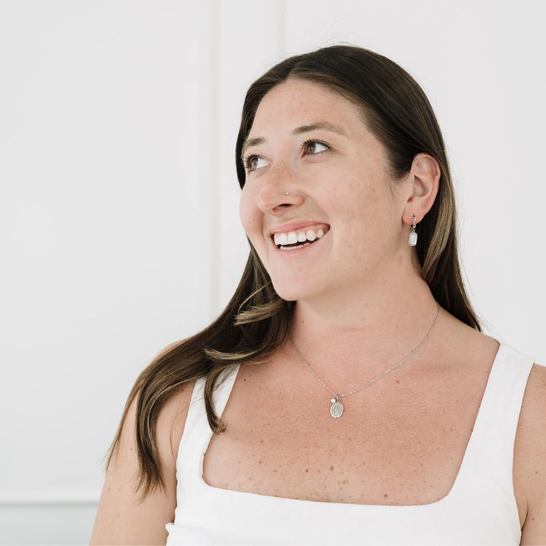 Brunette model wearing silver necklace
