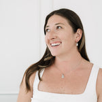 Brunette model wearing silver necklace