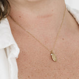 Detailed shot of gold miraculous medal