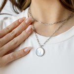 Silver mother mary with paperclip