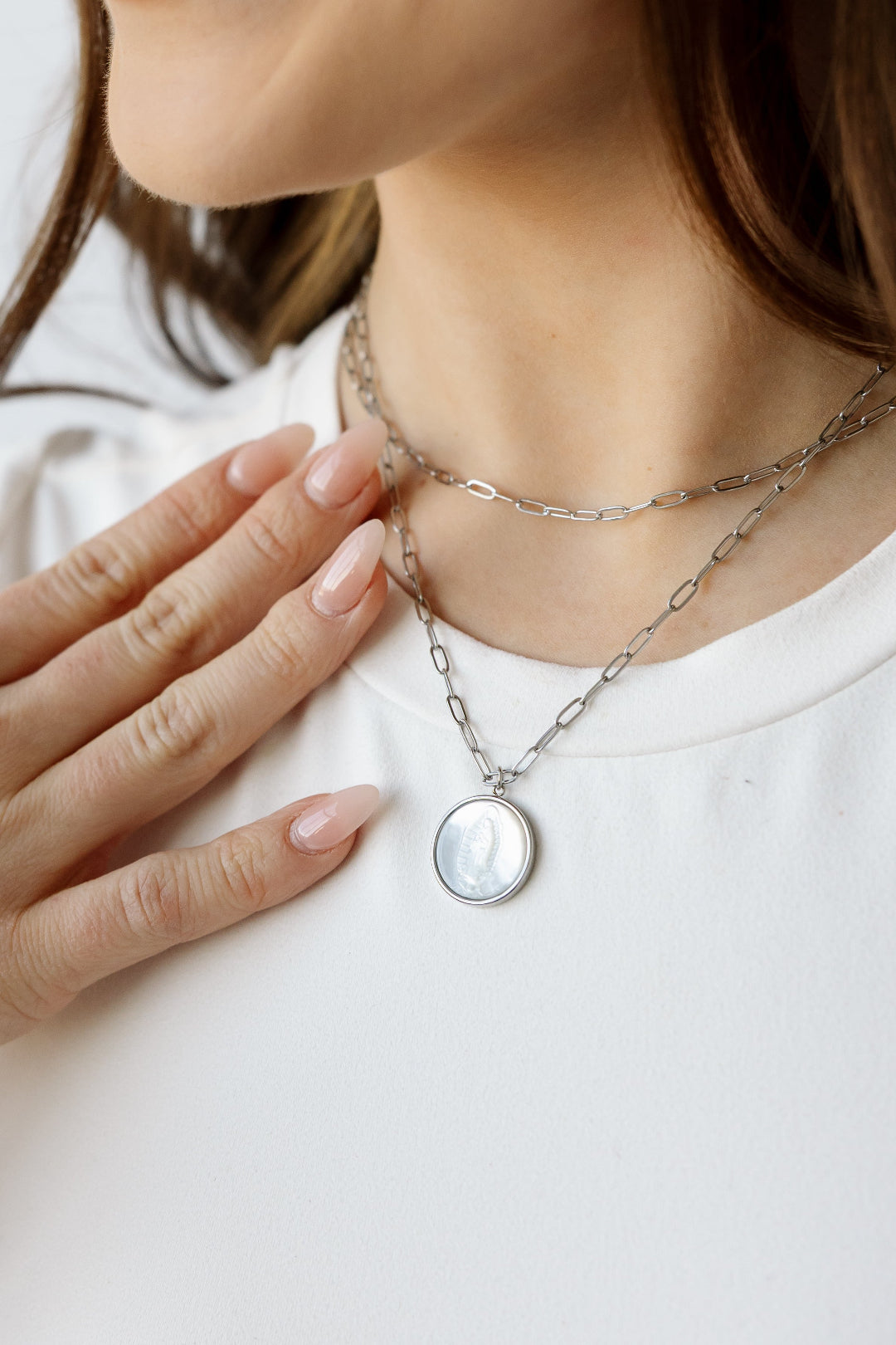 Silver mother mary with paperclip