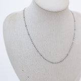 Mannequin displaying silver satellite