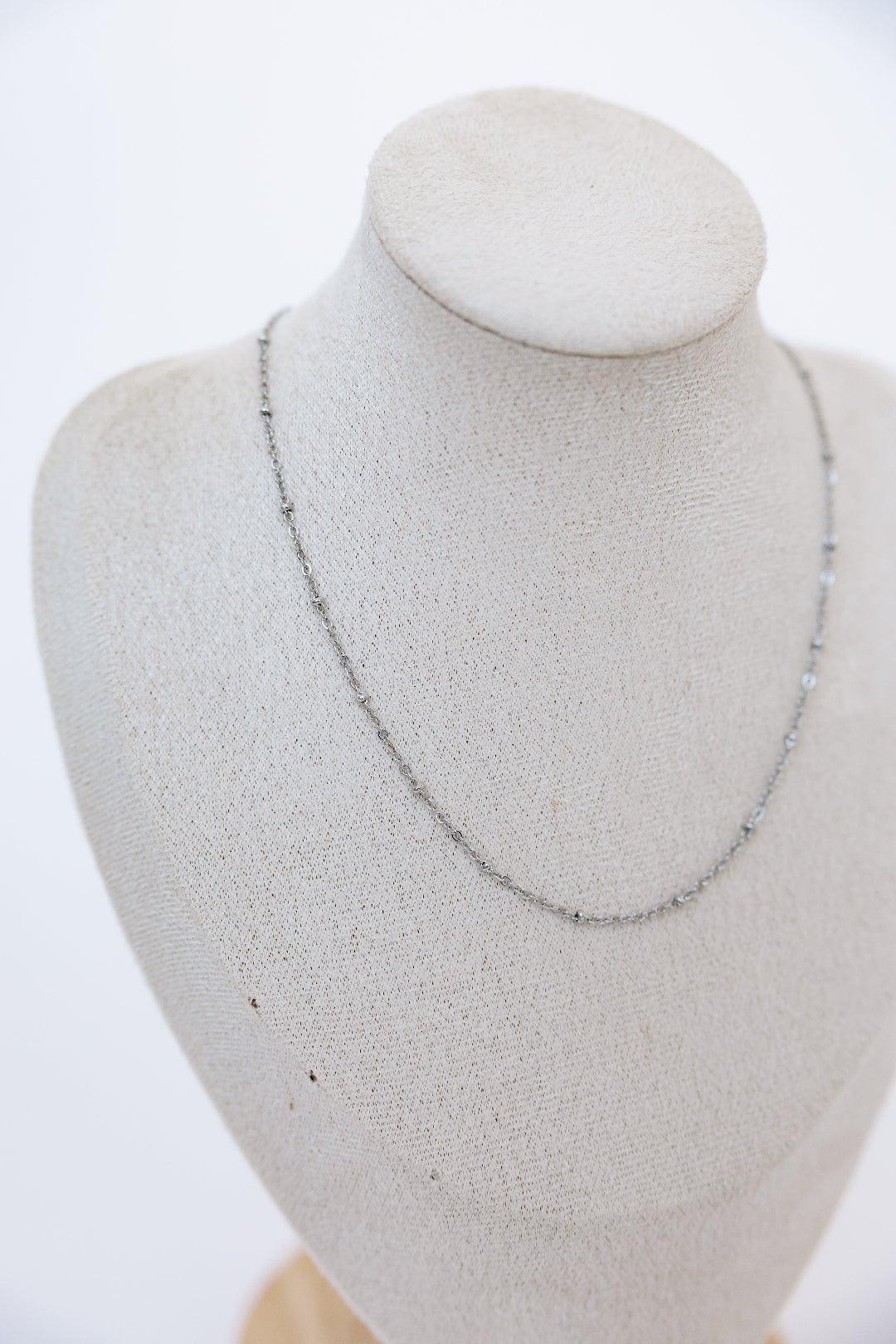 Mannequin displaying silver satellite