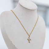 Mannequin displaying cross necklace