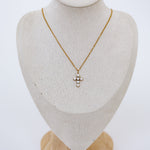 Full mannequin displaying cross necklace