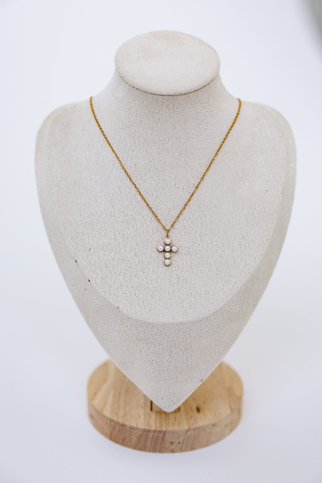 Full mannequin displaying cross necklace
