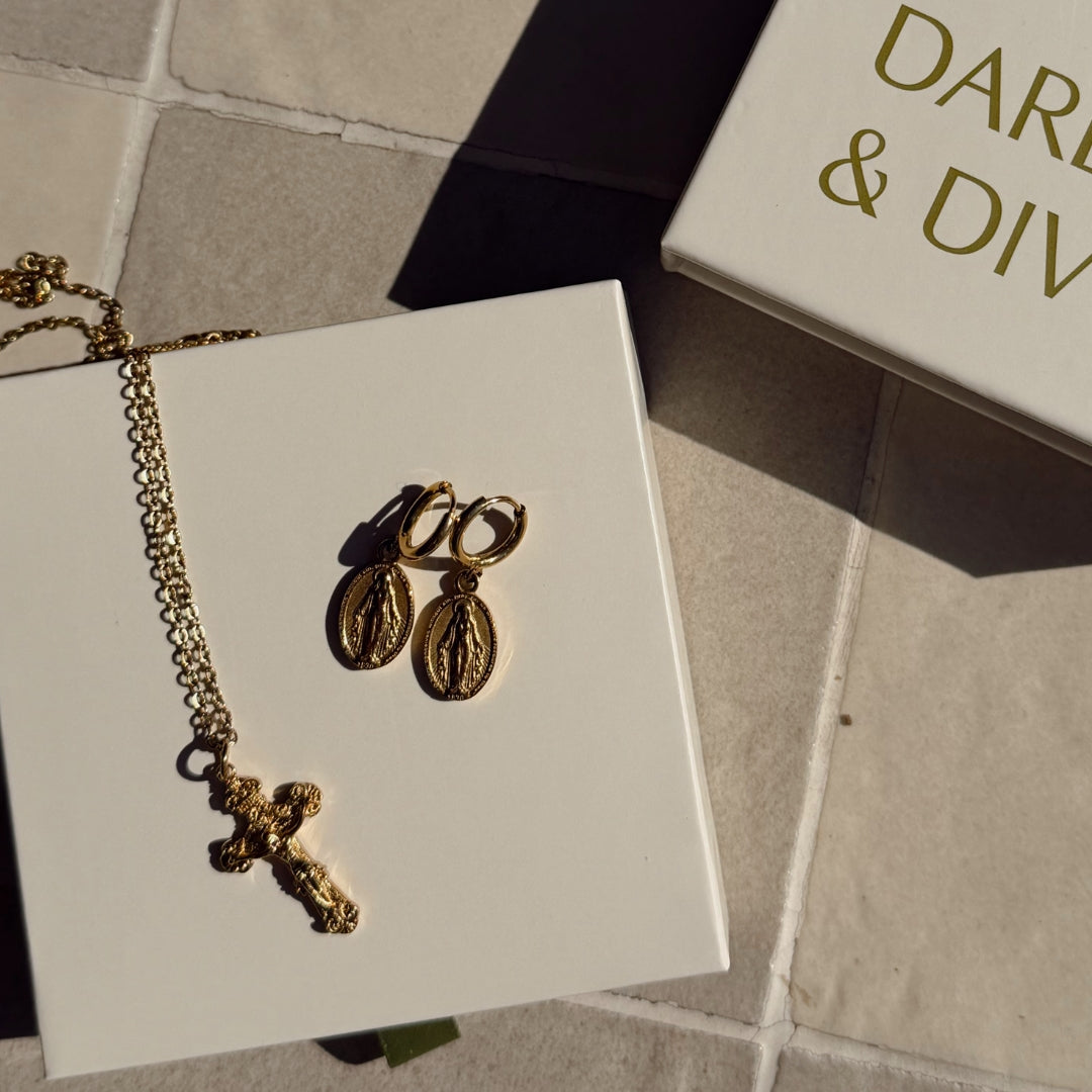 Detailed shot of crucifix and huggies