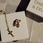 Detailed shot of crucifix and huggies