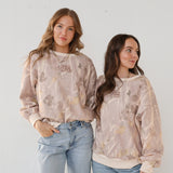 Two models side by side in camo crewneck