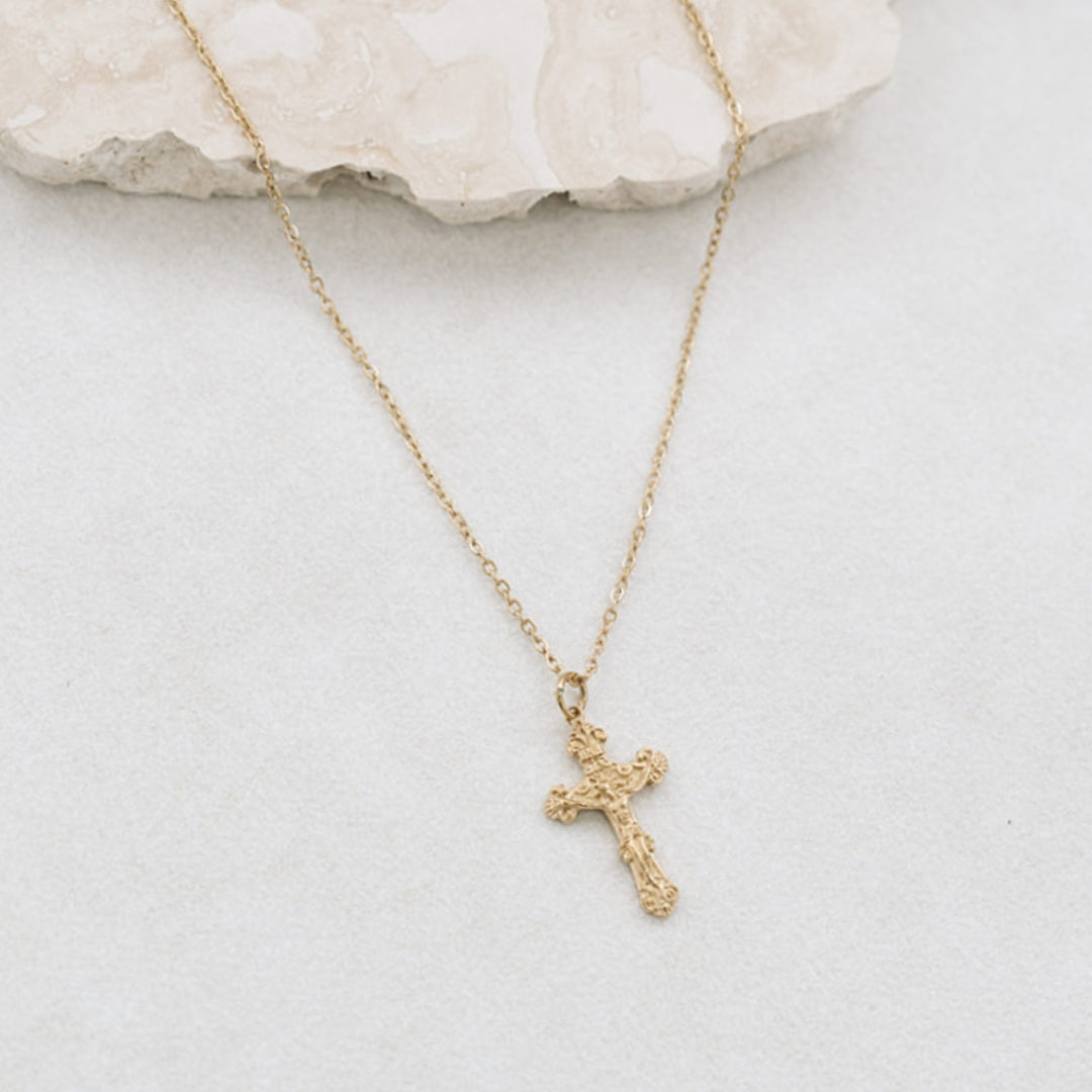 Clean background vintage crucifix necklace