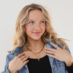 Blonde model with 3 necklaces