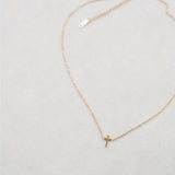 White background cross necklace