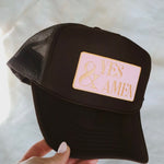 Hand holding trucker hat