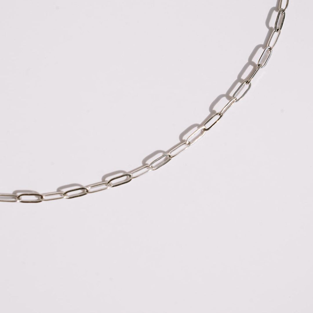 Silver paperclip chain white background