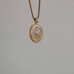 Miraculous Medal Pendant Hanging in air with white background