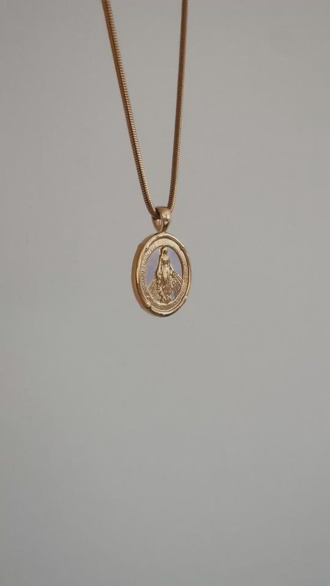 Miraculous Medal Pendant Hanging in air with white background